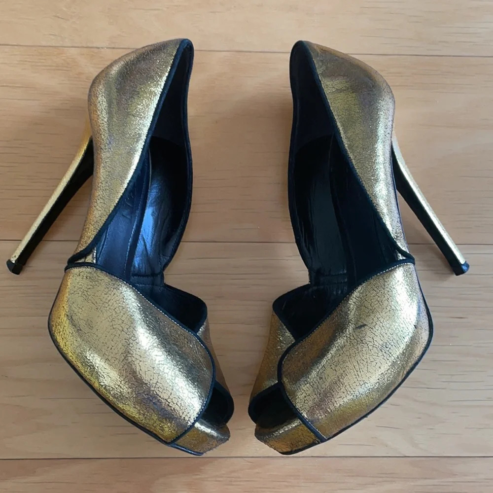 Alexander McQueen gold and black peep toe stilettos